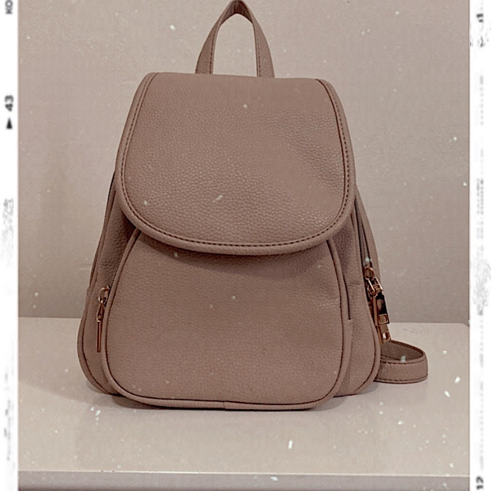 I am selling does light brown small book-bag